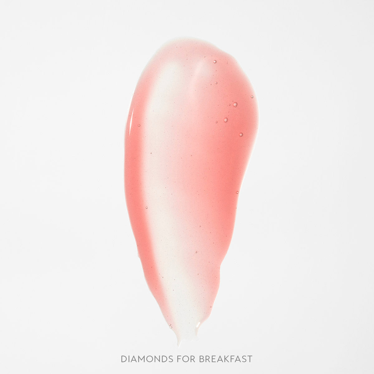 Błyszczyk do ust Hedonista Diamonds For Breakfast Lipgloss – jasny, transparentny różowy odcień, swatch produktu