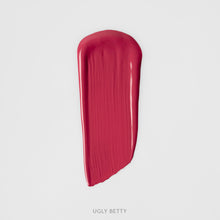 Matowa pomadka Hedonista Ugly Betty Lipstick – intensywny malinowo-fuksjowy odcień, swatch produktu