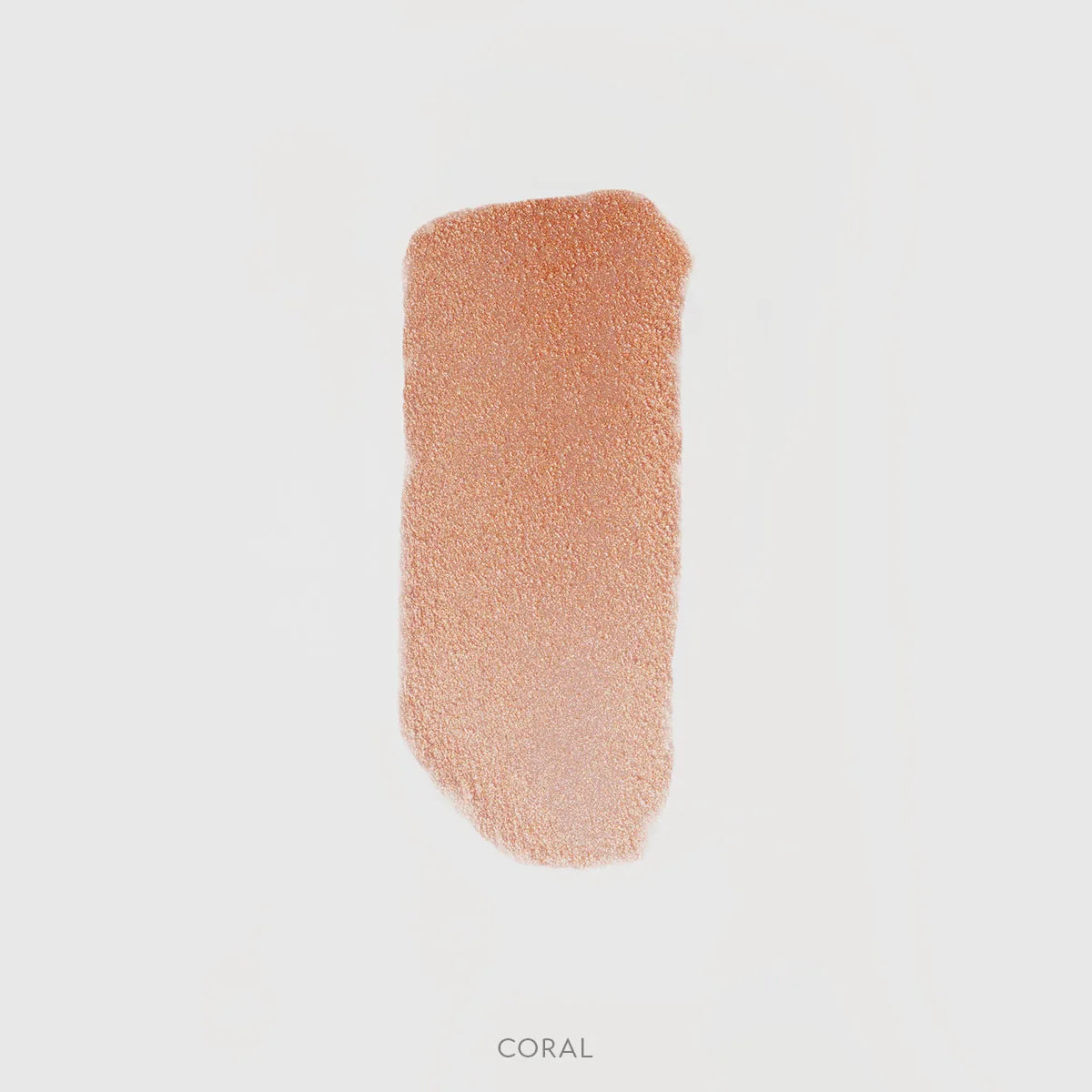 Róż rozświetlający Hedonista RoseLighter Cream Coral – kremowy koralowy odcień, swatch produktu